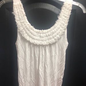 Cream colored tank with detailed neck line